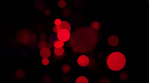 Abstract red glowing particles on dark background, soft blur bokeh light with fl 库存影片 296881810