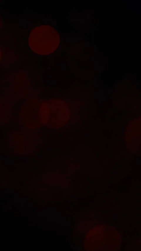 Abstract red light bokeh background with soft glowing circles moving slowly in Stock Footage 347692460