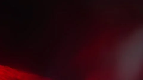 Abstract red light leak texture background against a dark backdrop. Stock Footage 342796963
