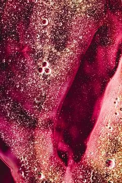 Abstract red liquid background, paint splash, swirl pattern and water drops Foto stock