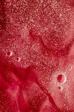 Abstract red liquid background, paint splash, swirl pattern and water drops Stock Photos
