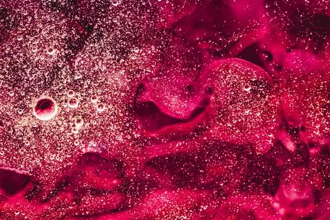Abstract red liquid background, paint splash, swirl pattern and water drops Stock Photos