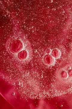 Abstract red liquid background, paint splash, swirl pattern and water drop... Stock Photos