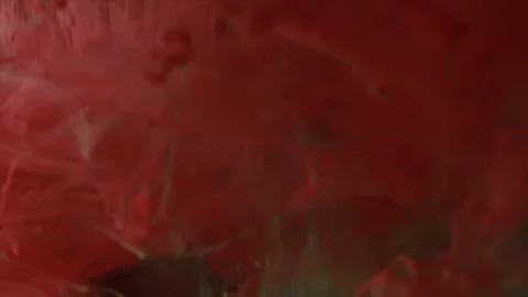 Abstract red paint on the dark background Vídeos de archivo 85843500