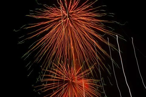 Abstract red patterns of fireworks explosions at Christmas night Stock Photos