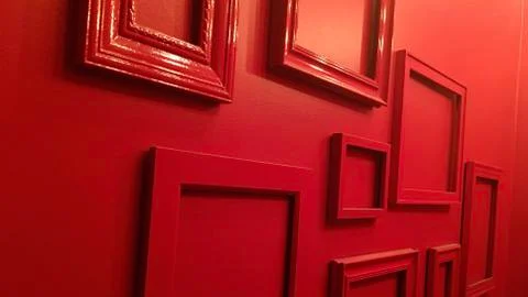 Abstract red picture frames create pattern on red wall Foto stock