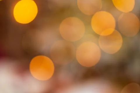 Abstract red red blurred background with defocus round bokeh effects in yello Stock Photos