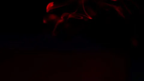 Abstract red smoke wisps moving mysteriously in darkness Stock Footage 337001403