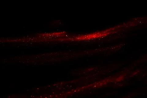 Abstract red speed camera motion background over glowing lights with sparkles Stock Photos