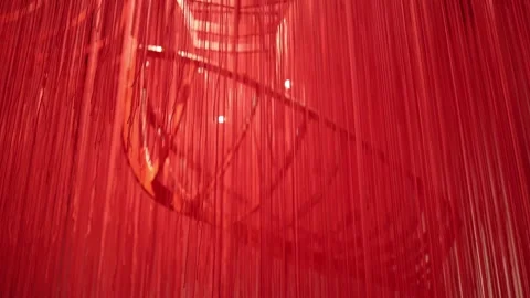Abstract red thread installation with a skeletal boat structure subtly visible b Stock Footage 304358129