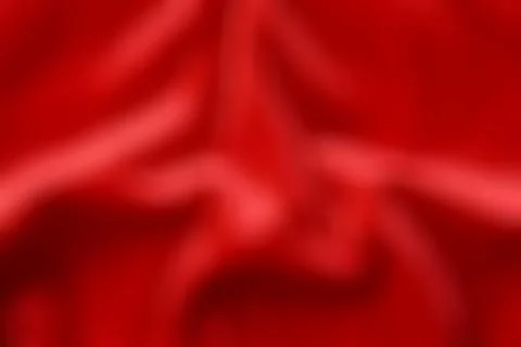 Abstract red wavy texture, blurred background. Stock Photos