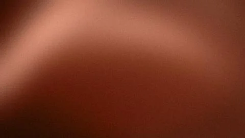 Abstract reddish brown grainy background with warm brown shades 4K high res.. Stock Photos
