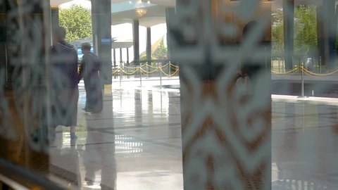 Abstract reflection and silhouette of people in the National Mosque Stock Footage 107565673