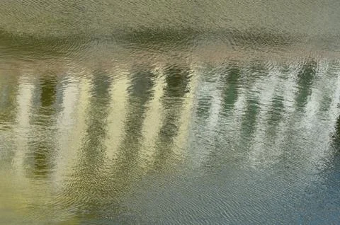Abstract reflection of buildings in a river. Stock Photos