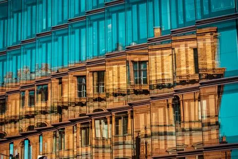 Abstract reflection of a historic brick facade in turquoise glass Photos
