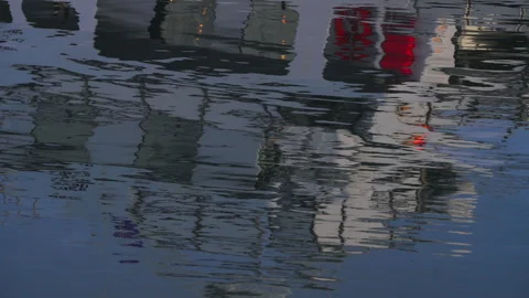 Abstract reflection of a white boat on calm blue sea water, rippling liquid.. Stock Footage 328459918