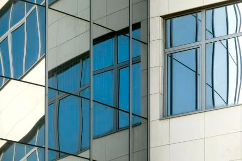 Abstract reflection in windows of modern building Stock Photos