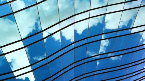 Abstract reflections of clouds on modern glass building facade motion. Vídeo Stock 342356789