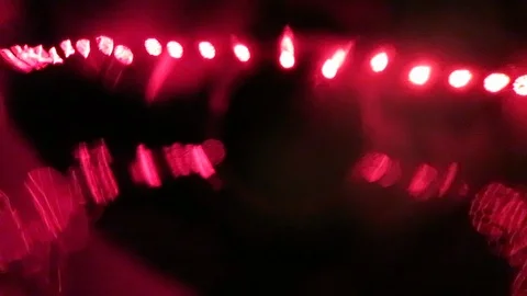 Abstract reflections of lights through red glass￼ Stockbeeldmateriaal 119078673