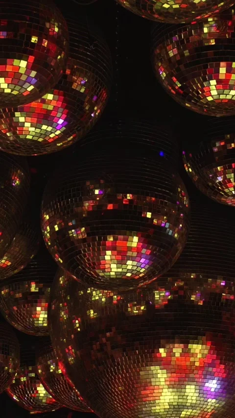 Abstract Reflections on Multiple Disco Balls Against Black Background Stock Footage 276553818