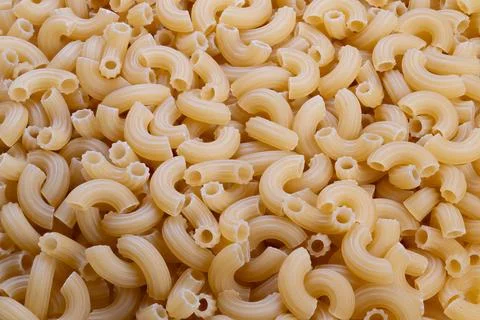 Abstract repeating elbow macaroni pattern creating rhythmic shapes and curves 写真素材