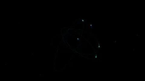 Abstract representation of atomic structure with glowing orbital electron r.. Stock Footage 345055987