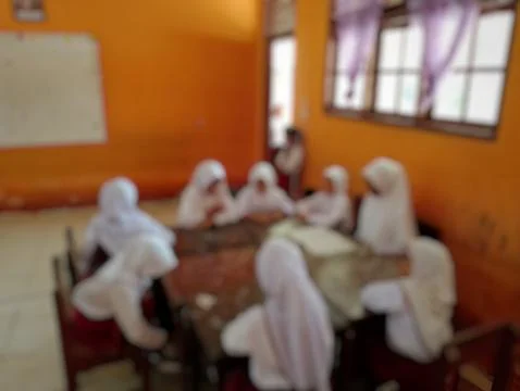 Abstract Representation of Elementary Students in an Orange Classroom Stock Photos