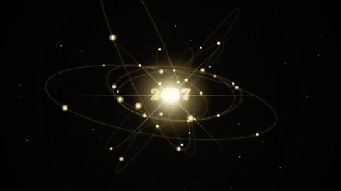 Abstract representation of a golden atomic structure with orbiting glowing .. Stock Footage 345055957