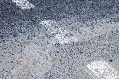 Abstract representation of road texture with white line markings 写真素材