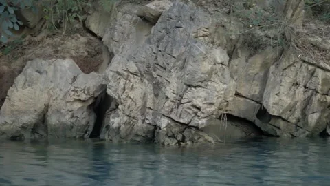 Abstract Rock Texture and Deep Blue Water Stock Footage 302956134