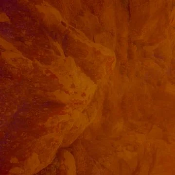 Abstract rock texture in warm orange tones with natural surface pattern Stock Photos