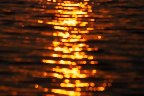 Abstract romantic background, waves at sunset in defocus Stock Photos