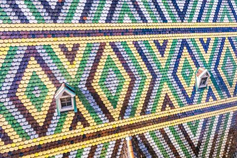 Abstract roof pattern with lonely window of St Stephen's Cathedral in Vienna Stock Photos