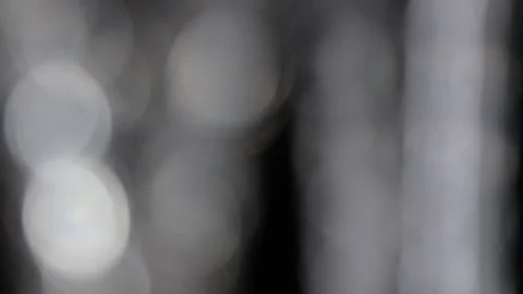 Abstract rotating glass light reflections on a black background Stock Footage 250621133