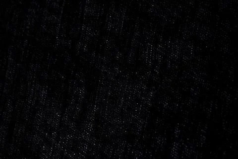 Abstract rough dark background of linen natural fabric on the light, short fo Stock Photos