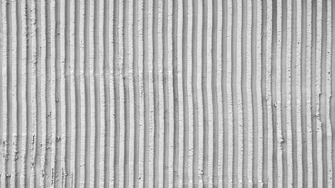 Abstract rough texture with vertical stripes on concrete wall black and white Stock Photos