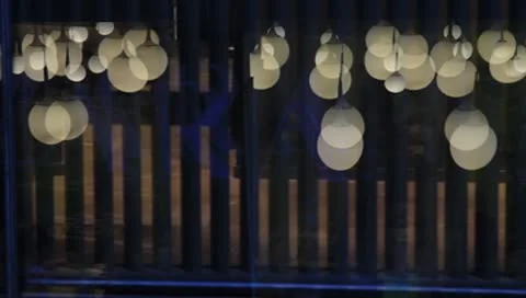 Abstract round lamps reflected on window Video stock 8984692