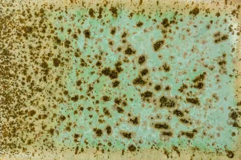 Abstract rust texture with green, brown and yellow scuffs. abstract aged patt 库存照片