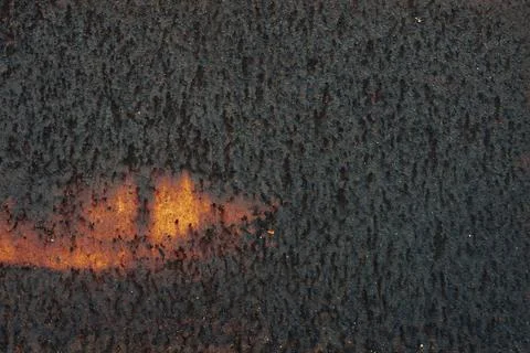 Abstract Rust Texture with Lava?Like Glow on Dark Surface Stock Photos