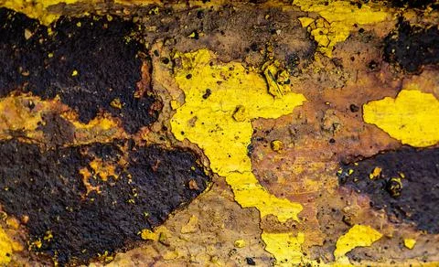 Abstract rusty metal texture in aged yellow paint closeup Stock Photos