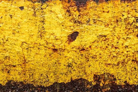 Abstract rusty metal texture in aged yellow paint closeup Stock Photos