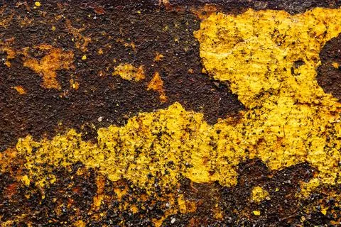 Abstract rusty metal texture in aged yellow paint closeup Stock Photos