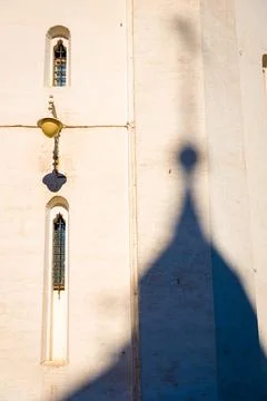 Abstract scene of dome shadow touching on old church building wall in Russia. Stock Photos