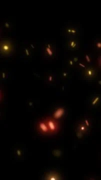 Abstract scene of glowing red and golden ember particles floating in darkne.. Stock Illustration