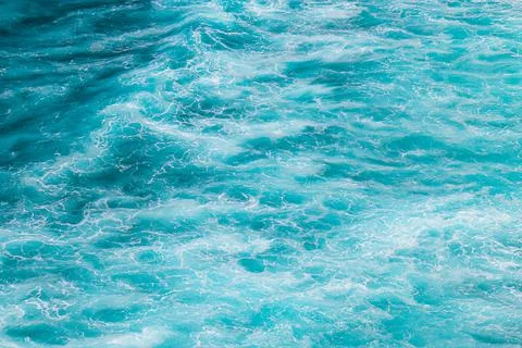 Abstract sea background. The surface of the blue, turquoise ocean. Stock Photos