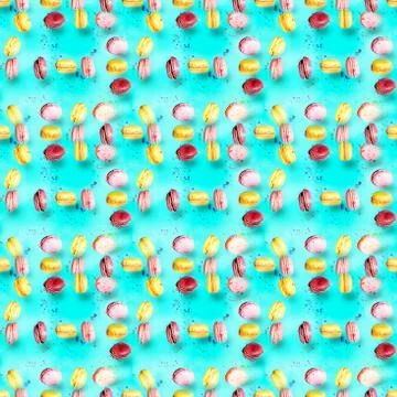 Abstract seamless pattern with flying colored macaroons, holiday concept. Stock Photos