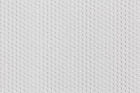 Abstract seamless white plastic pattern of hexagonal grid of circles Stock Photos