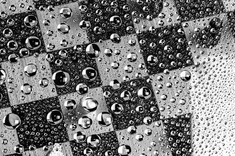 Abstract selective focus background on chess theme. water bubbles 库存照片