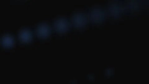 Abstract series of soft glowing blue orbs against a deep black background 스톡 동영상 339616292