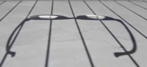 Abstract shadow of eyeglasses on surface 動画素材 337034008